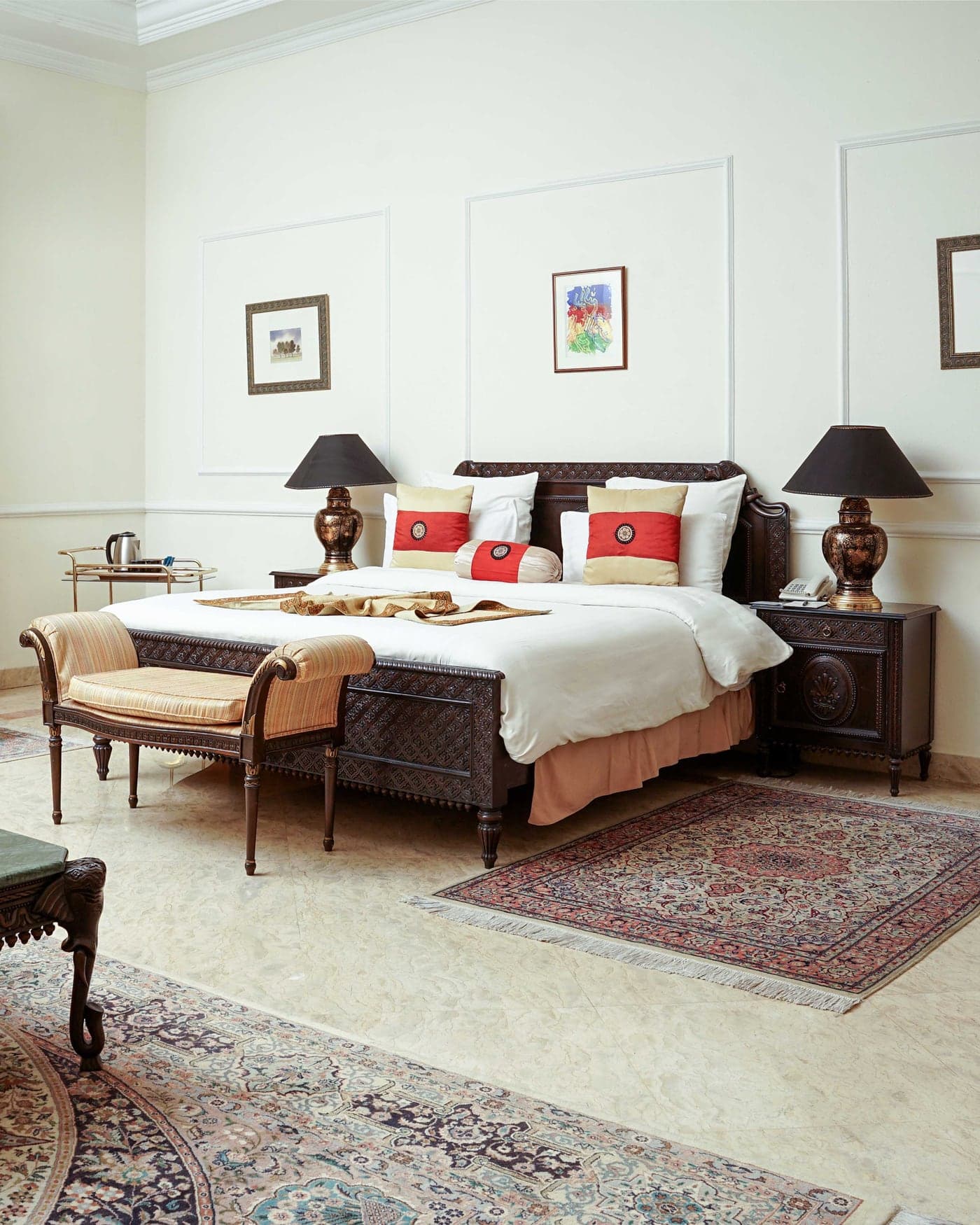 Standard Room at Etihad Club, with a dark wood bed and a panelled wall
